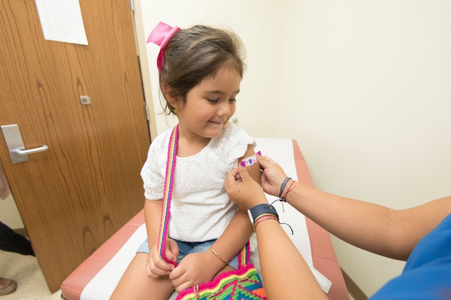 Little girl getting vaccinated against COVID-19